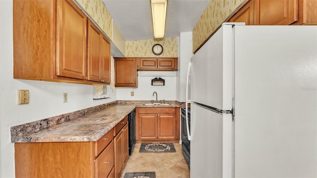 640 Forrest Dr, Bartow, FL 33830 - kitchen featuring freestanding refrigerator, brown cabinets, black dishwasher, and range with electric stovetop
