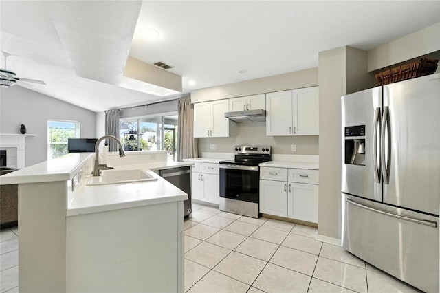 6410 Beechnut Dr, Lakeland, FL 33813 - kitchen with appliances with stainless steel finishes, ceiling fan, under cabinet range hood, light tile patterned floors, and light countertops