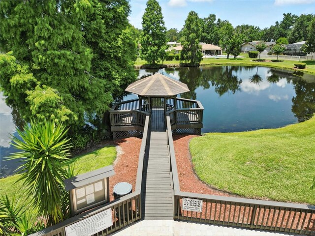6410 Beechnut Dr, Lakeland, FL 33813 - dock area featuring a deck with water view, a gazebo, and a yard