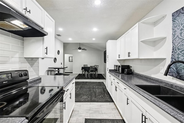 3854 Feather Dr, Lakeland, FL 33812 - kitchen with black range with electric stovetop, extractor fan, open shelves, white cabinets, and dark countertops
