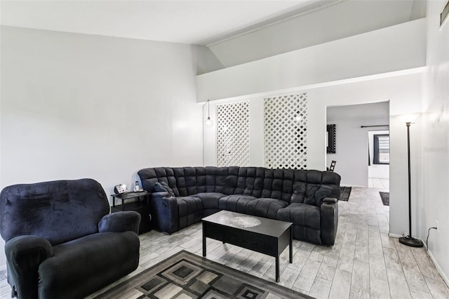 3854 Feather Dr, Lakeland, FL 33812 - living area with vaulted ceiling and light wood finished floors