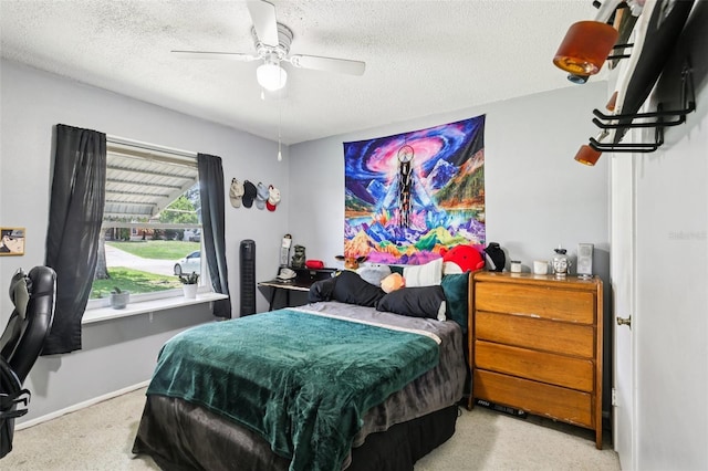 3854 Feather Dr, Lakeland, FL 33812 - carpeted bedroom with a textured ceiling and ceiling fan