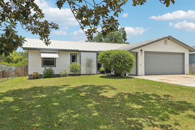 3854 Feather Dr, Lakeland, FL 33812 - ranch-style house featuring a metal roof, concrete driveway, and an attached garage