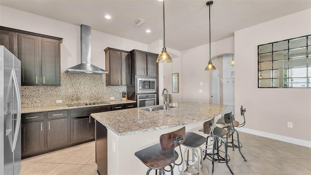 11825 Frost Aster Dr, Riverview, FL 33579 - kitchen with wall chimney range hood, appliances with stainless steel finishes, light tile patterned floors, tasteful backsplash, and light stone counters