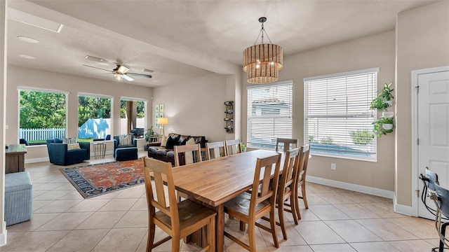 11825 Frost Aster Dr, Riverview, FL 33579 - dining area featuring light tile patterned floors, healthy amount of natural light, and ceiling fan