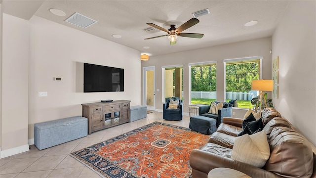 11825 Frost Aster Dr, Riverview, FL 33579 - living area with light tile patterned floors and ceiling fan