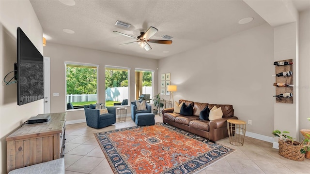 11825 Frost Aster Dr, Riverview, FL 33579 - living area featuring light tile patterned floors, ceiling fan, and a textured ceiling