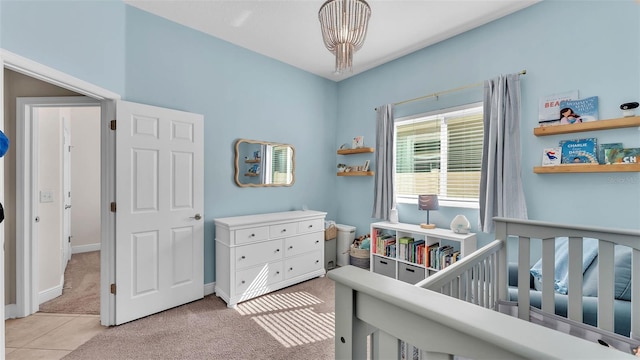 11825 Frost Aster Dr, Riverview, FL 33579 - bedroom featuring a nursery area, light colored carpet, and a chandelier