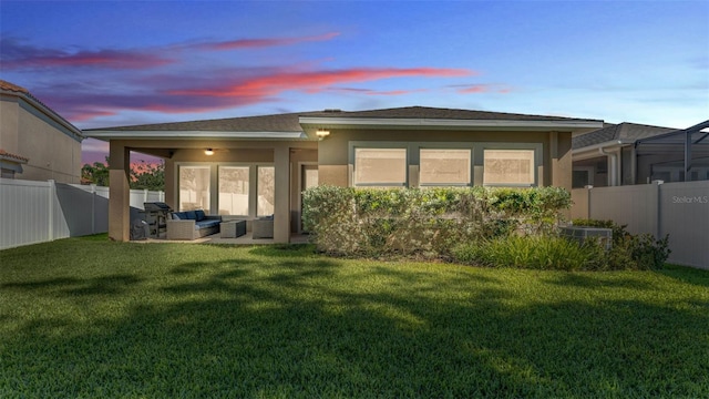 11825 Frost Aster Dr, Riverview, FL 33579 - back of property featuring outdoor lounge area, a fenced backyard, and stucco siding