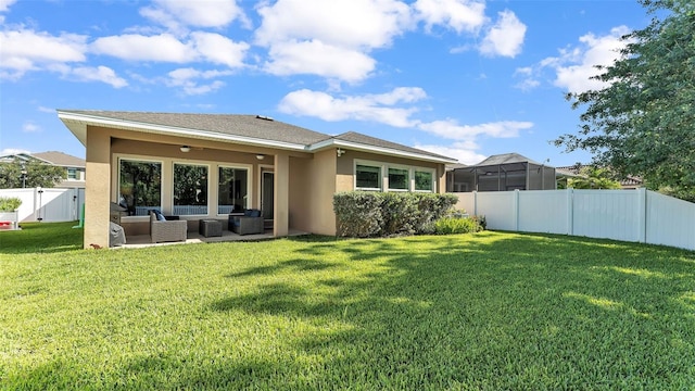 11825 Frost Aster Dr, Riverview, FL 33579 - back of property featuring an outdoor hangout area, stucco siding, a fenced backyard, and a patio area