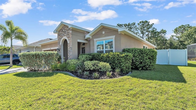11825 Frost Aster Dr, Riverview, FL 33579 - view of front of home with stucco siding and stone siding