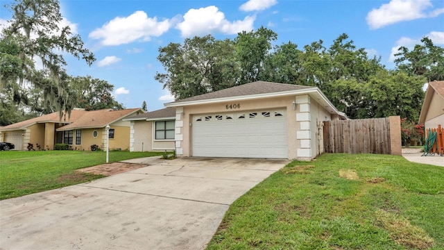 6406 Butternut Dr, Lakeland, FL 33813 - ranch-style house featuring stucco siding, a garage, and concrete driveway