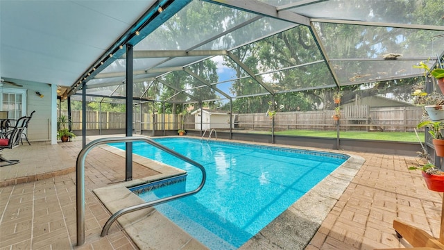 6406 Butternut Dr, Lakeland, FL 33813 - view of swimming pool featuring a fenced backyard, a patio area, and a lanai