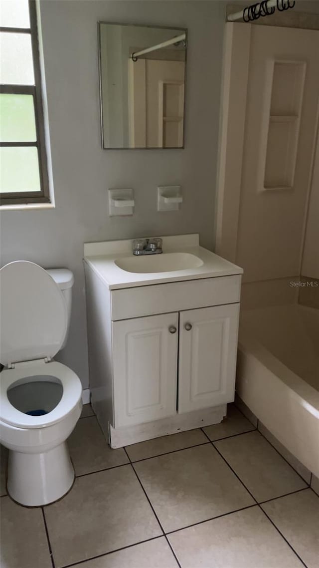 2708 Dixie Rd, Lakeland, FL 33801 - bathroom with vanity, tile patterned floors, and  shower combination