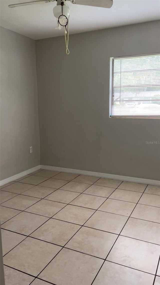 2708 Dixie Rd, Lakeland, FL 33801 - spare room with light tile patterned floors and baseboards