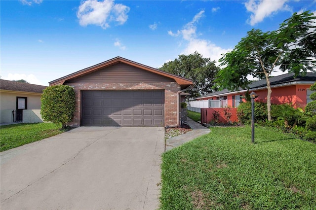 1523 Mariner Rd, Lakeland, FL 33803 - ranch-style home featuring brick siding, a front lawn, and concrete driveway