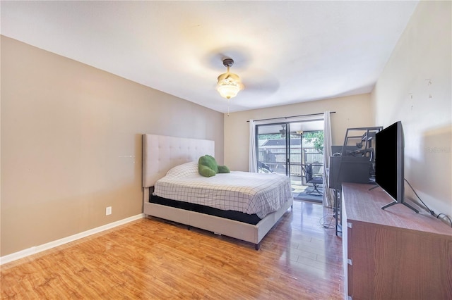 1523 Mariner Rd, Lakeland, FL 33803 - bedroom featuring access to exterior, wood finished floors, and ceiling fan