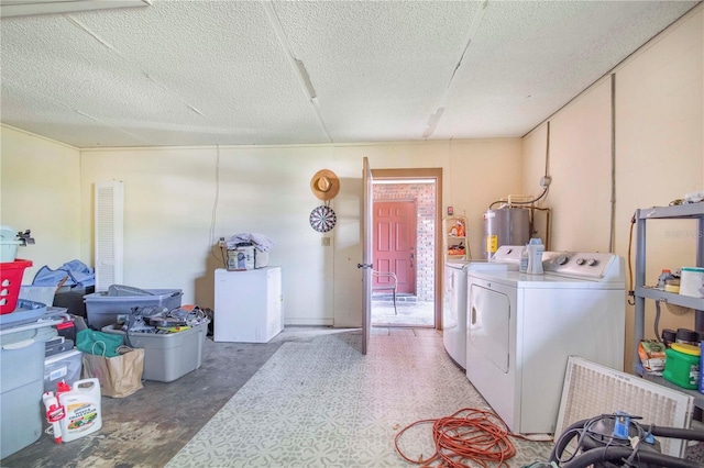 1523 Mariner Rd, Lakeland, FL 33803 - laundry room featuring independent washer and dryer, water heater, and a textured ceiling