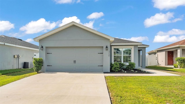 3739 Peregrine Way, Lakeland, FL 33811 - single story home with stucco siding, a front lawn, and concrete driveway