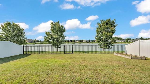 3739 Peregrine Way, Lakeland, FL 33811 - fenced backyard with a water view and a garden
