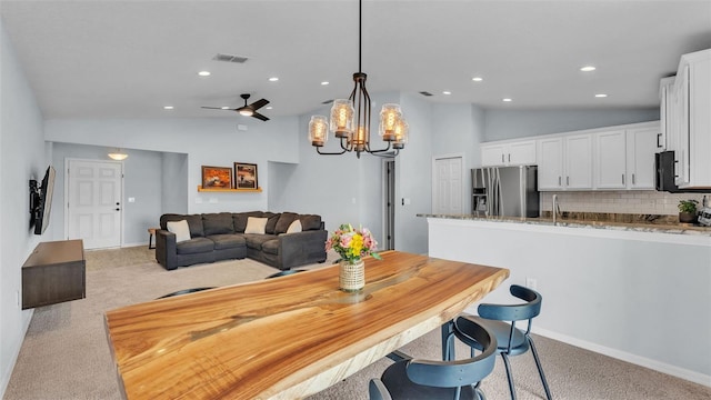 3739 Peregrine Way, Lakeland, FL 33811 - dining space with vaulted ceiling, light colored carpet, a chandelier, recessed lighting, and ceiling fan