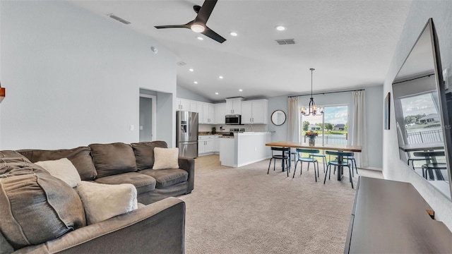 3739 Peregrine Way, Lakeland, FL 33811 - living area with ceiling fan, light carpet, a chandelier, recessed lighting, and high vaulted ceiling