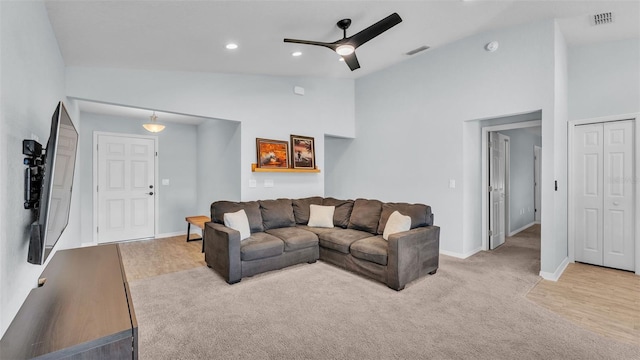 3739 Peregrine Way, Lakeland, FL 33811 - living room with lofted ceiling, ceiling fan, recessed lighting, and light carpet