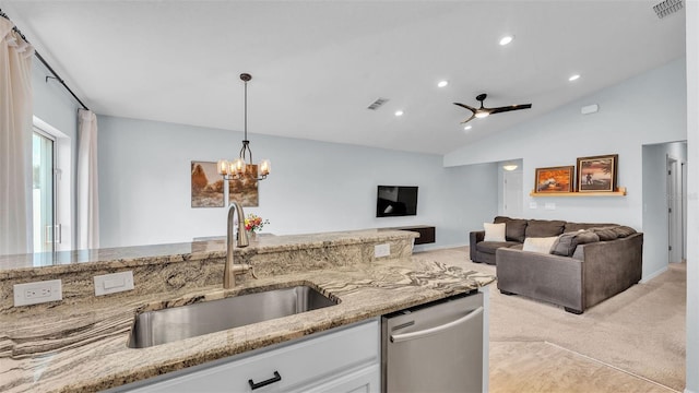 3739 Peregrine Way, Lakeland, FL 33811 - kitchen featuring stainless steel dishwasher, light carpet, light stone countertops, white cabinetry, and lofted ceiling