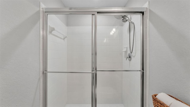 3739 Peregrine Way, Lakeland, FL 33811 - full bath with a textured wall and a shower stall