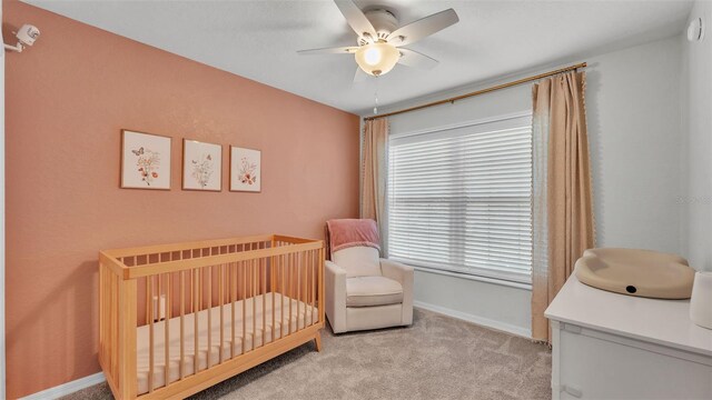 3739 Peregrine Way, Lakeland, FL 33811 - carpeted bedroom featuring a nursery area and a ceiling fan