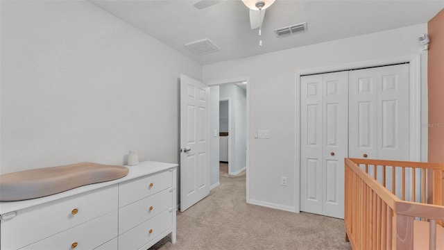 3739 Peregrine Way, Lakeland, FL 33811 - bedroom with light colored carpet, a closet, and ceiling fan