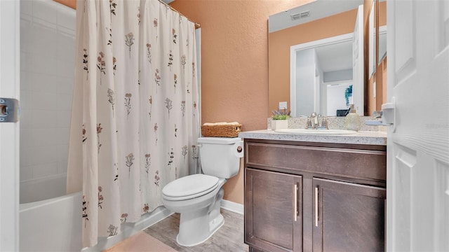 3739 Peregrine Way, Lakeland, FL 33811 - bathroom featuring a textured wall, vanity, and shower / bathtub combination with curtain
