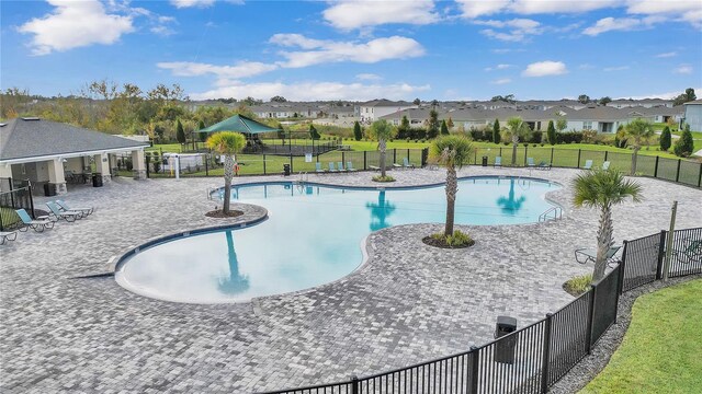 3739 Peregrine Way, Lakeland, FL 33811 - community pool with a residential view and a patio area