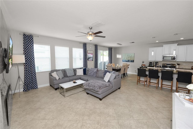1044 Oliveto Verdi Ct, Brandon, FL 33511 - living room with ceiling fan, recessed lighting, and light tile patterned flooring