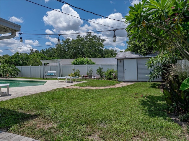 1232 Fairlee St, Lakeland, FL 33813 - fenced backyard featuring a storage unit and a patio