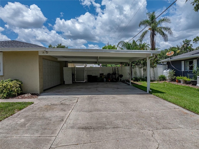 1232 Fairlee St, Lakeland, FL 33813 - view of parking / parking lot featuring concrete driveway, a carport, and an attached garage