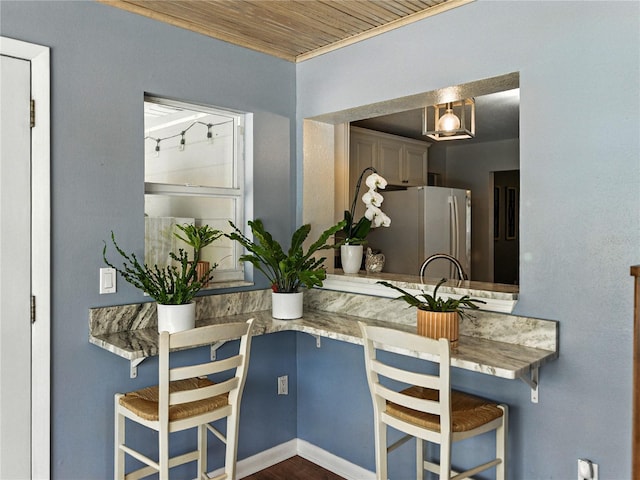 1232 Fairlee St, Lakeland, FL 33813 - dining room with wooden ceiling and dark wood-style floors