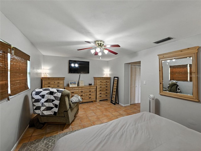 1232 Fairlee St, Lakeland, FL 33813 - bedroom with light tile patterned flooring, a ceiling fan, and a closet