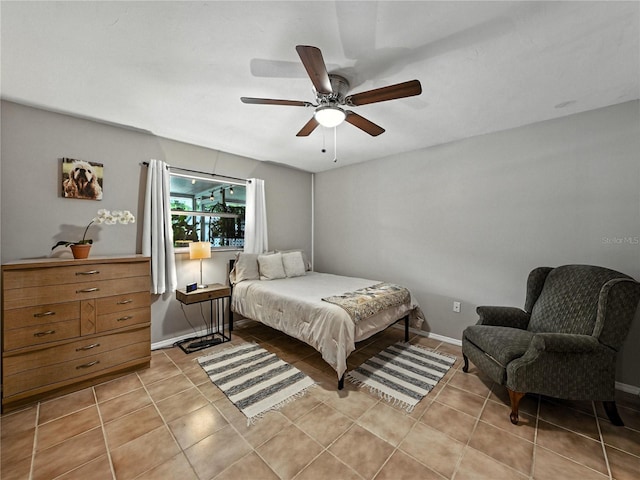 1232 Fairlee St, Lakeland, FL 33813 - bedroom featuring light tile patterned floors and a ceiling fan