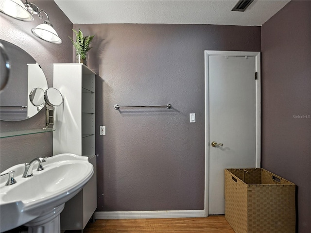 1232 Fairlee St, Lakeland, FL 33813 - bathroom with wood finished floors and baseboards
