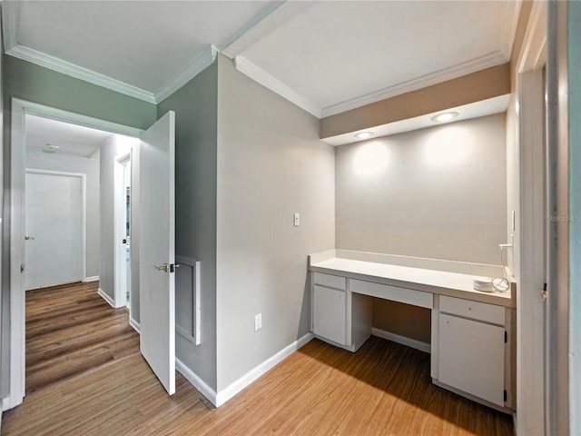 1232 Fairlee St, Lakeland, FL 33813 - unfurnished office featuring built in desk, ornamental molding, and light wood-style flooring