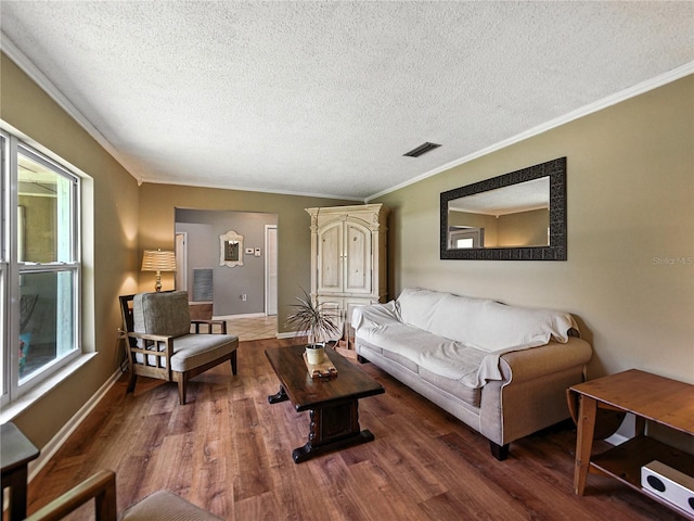 1232 Fairlee St, Lakeland, FL 33813 - living area featuring wood finished floors, a textured ceiling, and crown molding