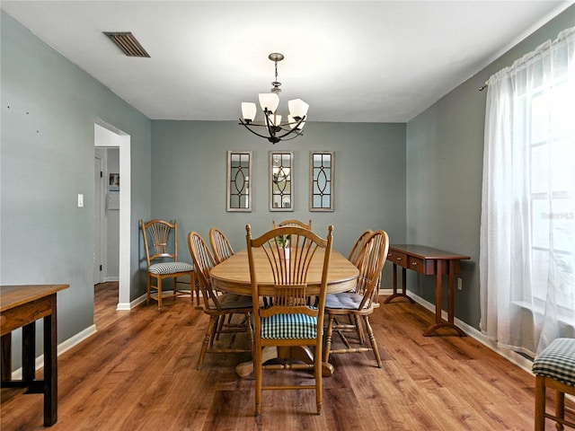 1232 Fairlee St, Lakeland, FL 33813 - dining area featuring a chandelier and wood finished floors