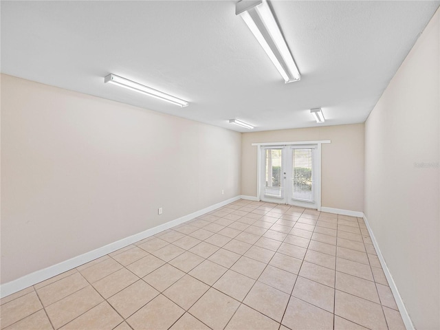 4230 Viola Rd, Lakeland, FL 33810 - spare room featuring light tile patterned flooring and french doors