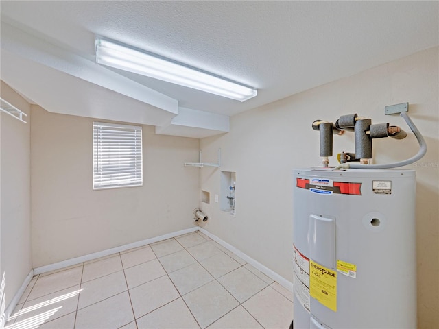 4230 Viola Rd, Lakeland, FL 33810 - washroom featuring electric water heater, washer hookup, light tile patterned floors, and a textured ceiling
