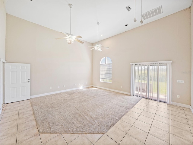 4230 Viola Rd, Lakeland, FL 33810 - empty room with high vaulted ceiling, light tile patterned floors, a ceiling fan, and light colored carpet