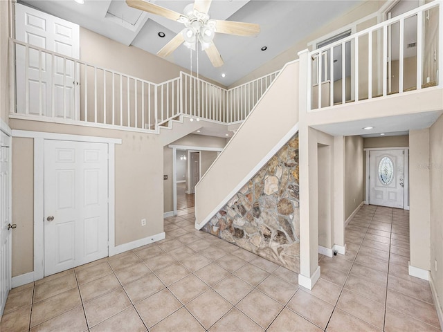 4230 Viola Rd, Lakeland, FL 33810 - staircase with a towering ceiling, a ceiling fan, tile patterned flooring, and recessed lighting