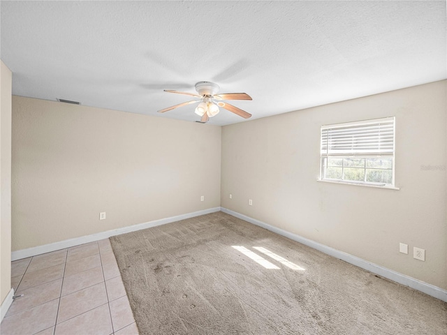 4230 Viola Rd, Lakeland, FL 33810 - spare room with ceiling fan, light tile patterned flooring, and a textured ceiling