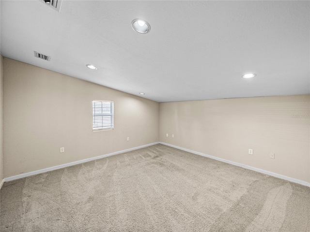 4230 Viola Rd, Lakeland, FL 33810 - spare room featuring recessed lighting, carpet, and lofted ceiling