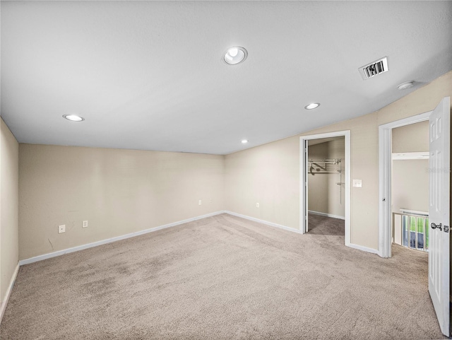 4230 Viola Rd, Lakeland, FL 33810 - unfurnished bedroom featuring carpet, recessed lighting, a spacious closet, and lofted ceiling